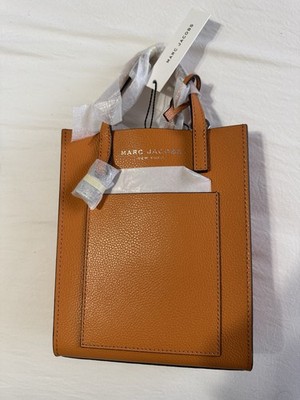 This is a Marc Jacobs Micro Grind Tote in leather and the color Desert Sun.
