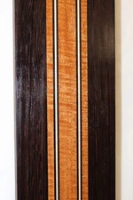 Figured mahogany, wenge and hard maple laminated guitar neck blank.