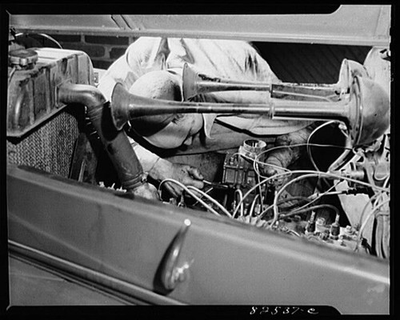 #ad Photo:Washington D.C. Mechanic adjusting a carburetor $9.99