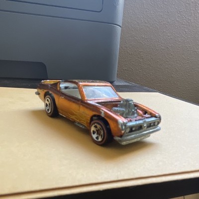 Extremely Rare1967 Barracuda hot wheels redlines. Metallic orange, blown engine 