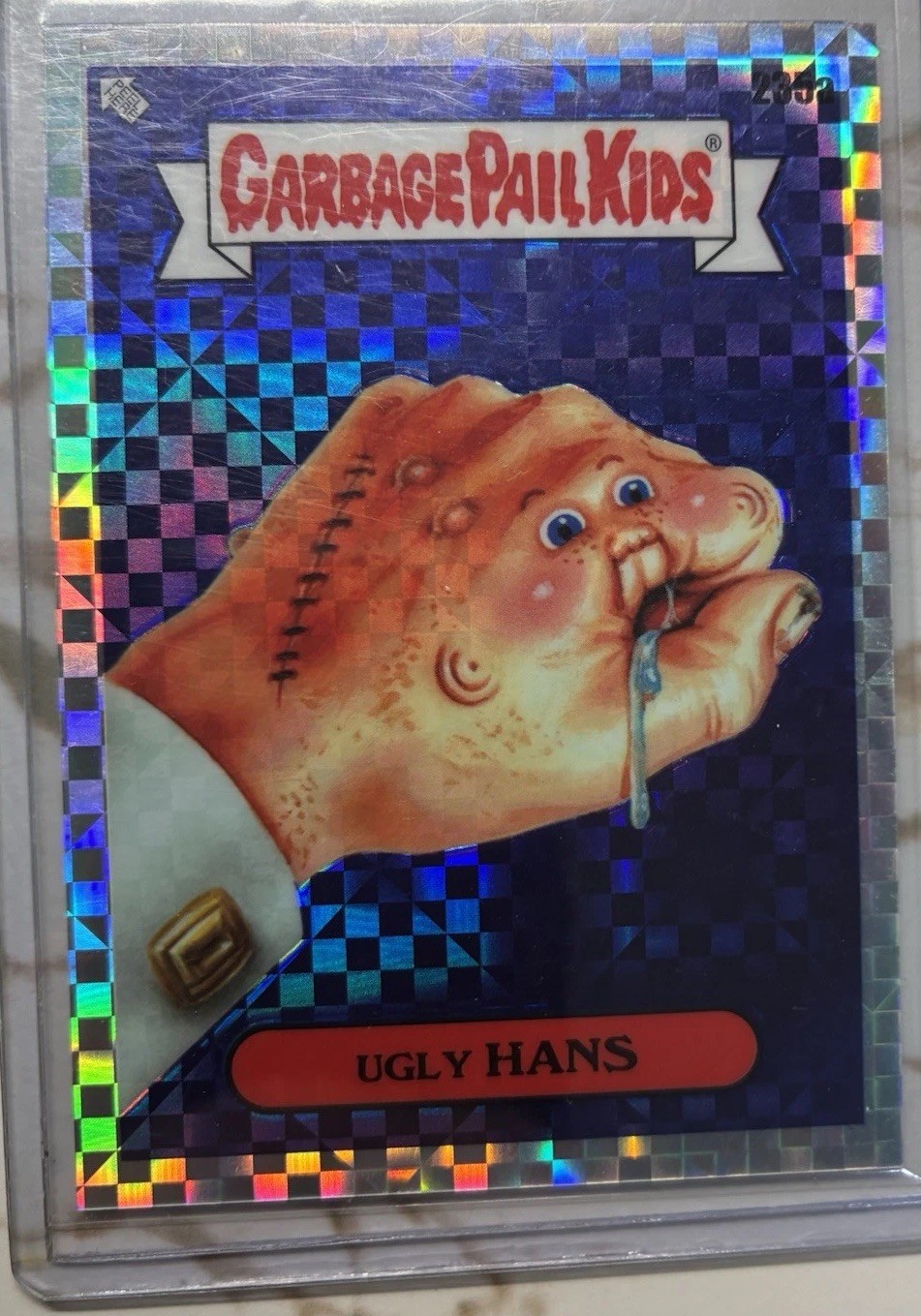 2023 Topps Garbage Pail Kids Chrome X-Fractor #235a Ugly Hans front