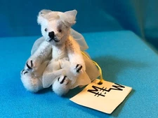 MINIATURE  2 1/4" JOINTED WHITE TEDDY BEAR BY "MLW" IN WHITE NYLON TUTU