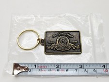 VINTAGE 1990's MGM LION LOGO PROMO METAL KEYCHAIN JAMES BOND 007 TANK GIRL MOVIE