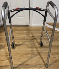 Drive Deluxe Folding Walker #10210-4ASM Two Button w/5" Wheels 350lbs Cap M4944