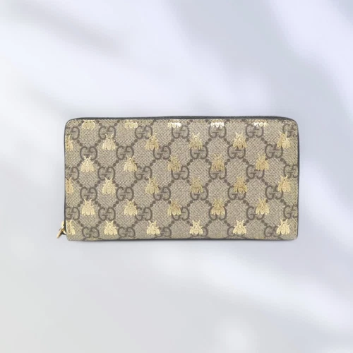 Portefeuille long Gucci 410102 GG Supreme toile beige/or occasion