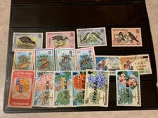 Lot de frais de port Montserrat tous différents environ 16 timbres d'occasion SKU#34955