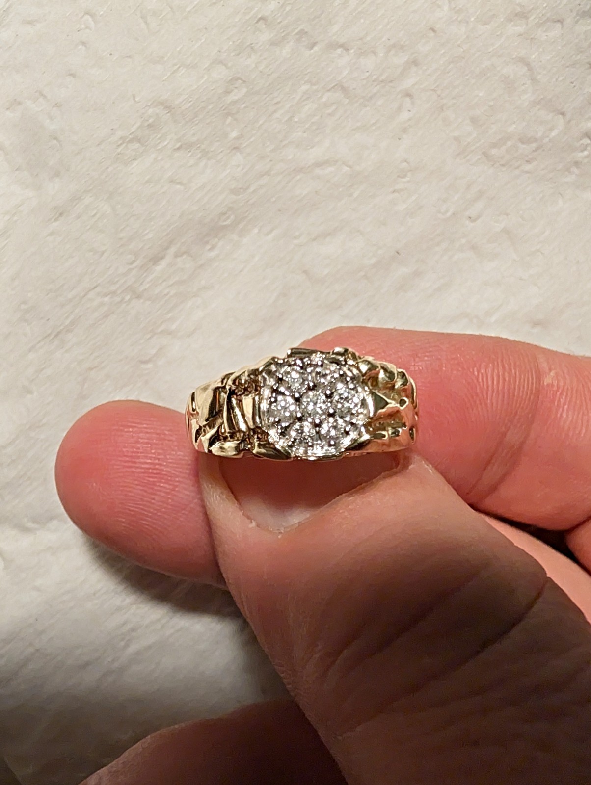 Elegant gold ring featuring multiple diamonds in … - image 3