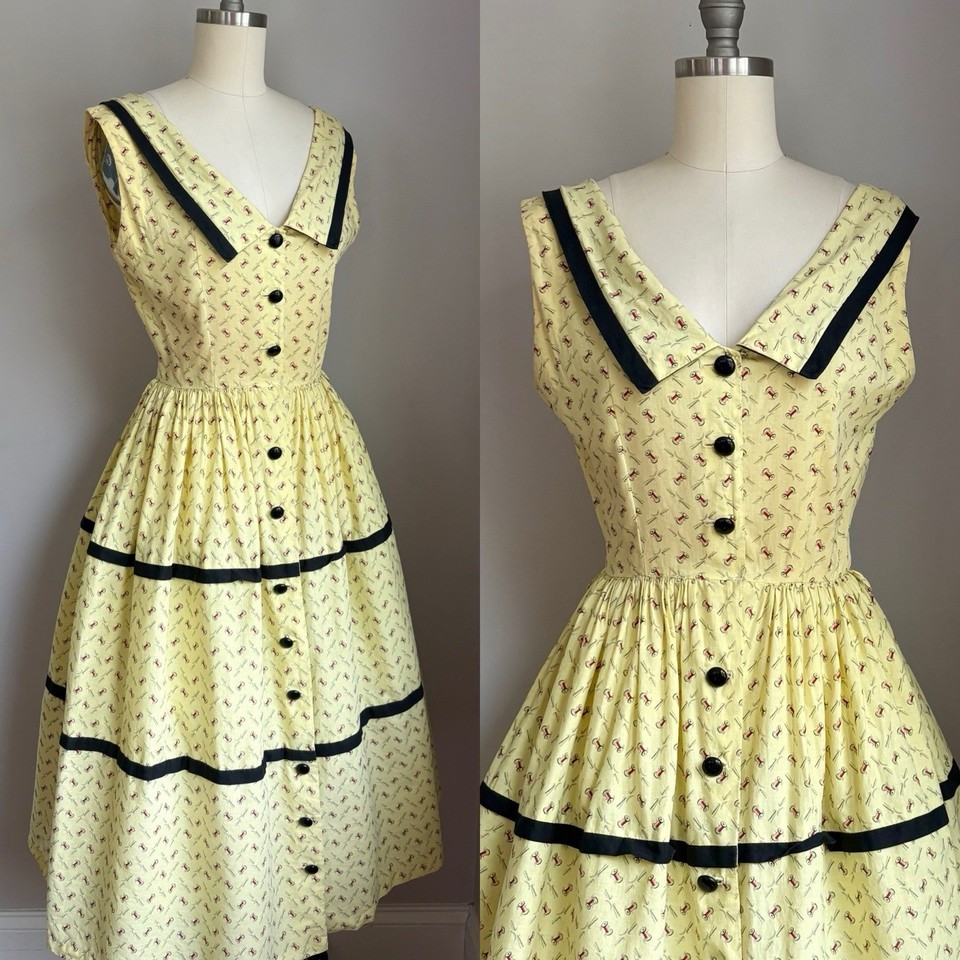 A genuine 1940s novelty print dress covered in sewing spools and needles — wearable art history that belongs in a museum (or a great wardrobe).