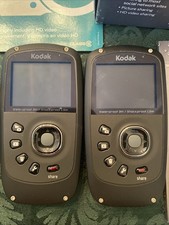 USED KODAK PLAY SPORT ZX5 CAMERA IN BOX SET OF 2 ORANGE RED WORKING TESTED