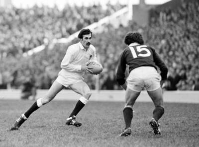 Mike Slemen of England and Andy Irvine of Scotland in action duri - Old Photo