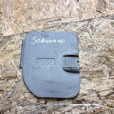 2006-2012 KIA SEDONA  FUSE BOX COVER LID