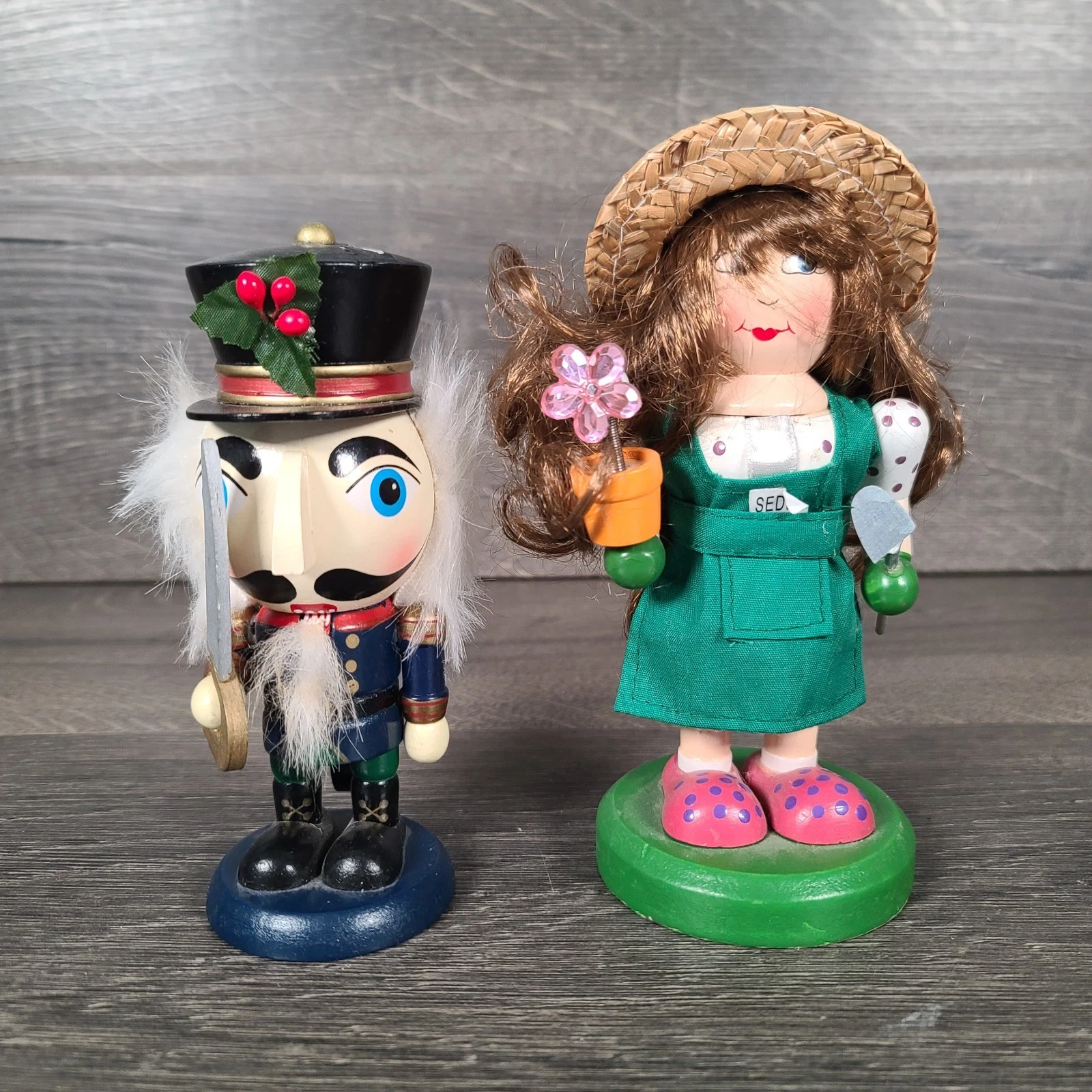 Lot of 2 Mini 6.5" Wooden Nutcrackers Soldier and Girl Gardener From Walmart
Opens in a new window o
