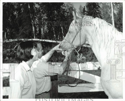 #ad Press Photo Couple checking a horse#x27;s teeth at farm in Anchorage Alaska $24.99