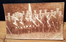 Group of Men with Hat & Dog - Crest with 2x Anchors 6x Crescent Moon? Photo