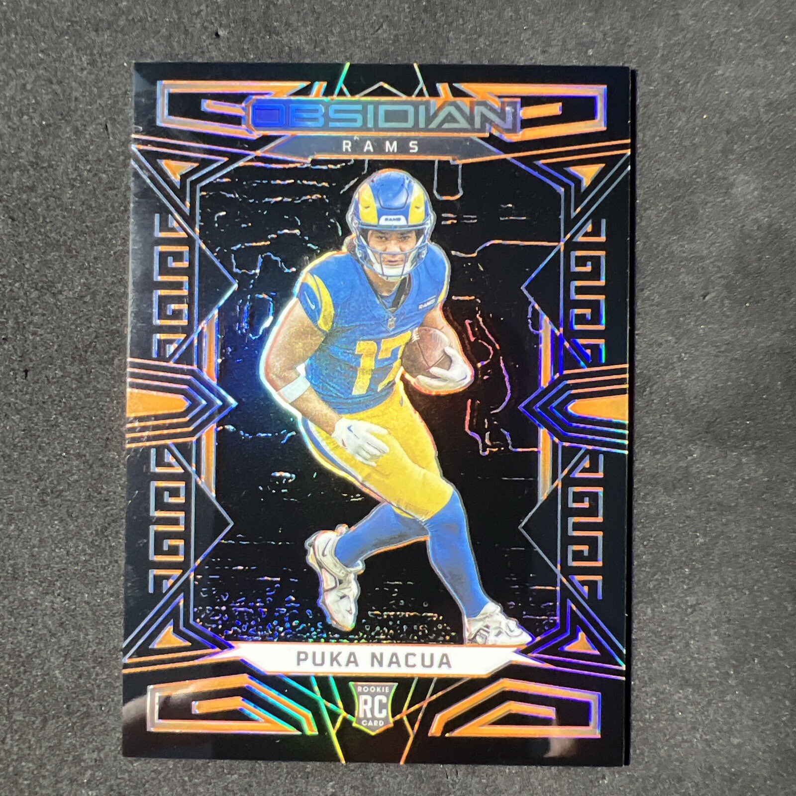 2023 Panini Obsidian - Orange Electric Etch #156 Puka Nacua /49 (RC)