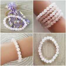 ROSE QUARTZ BRACELET WITH ORGANZA GIFT POUCH. STRETCH ELASTIC. BEADED 7MM.  