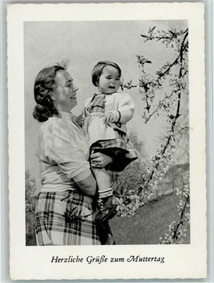 40138489 - Mother has daughter in dirndl on her arms Mother's Day