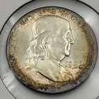 1958 P Franklin Half Dollar with peripheral toning and light rainbow qualities