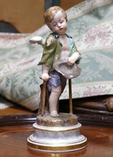 Meissen Porcelain Painted Figure of a Young Cherub Beggar late 19th century