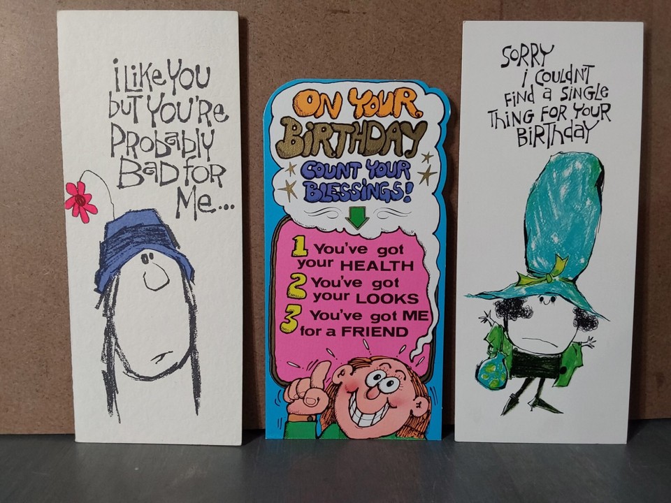 A lot of vintage 'Laugh Lines' novelty greeting cards — genuinely funny period humor with kitschy illustration charm that no modern card aisle can replicate.