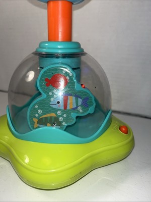 Bright Starts Press & Glow Spinner Cause and Effect Musical Baby Toy, Age 6 Mont