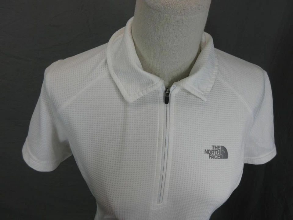 CAMISA POLO ATLÉTICA MUJER THE NORTH FACE BLANCA MANGA CORTA 1/2 CREMALLERA T584 Foto 2 de 4