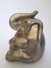 Vintage Mid-Century Handcrafted Heavy Cast Metal Sitting Elephant with Trunk Up