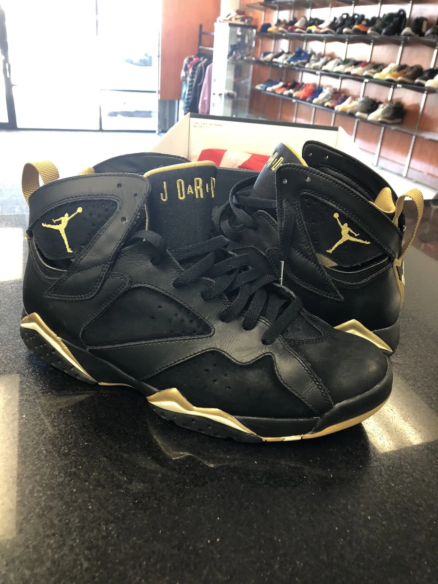 Jordan retro 7 black hotsell and gold