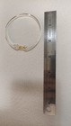 .925 sterling silver bracelet with a gold heart clasp