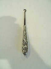BEAUTIFUL AMERICAN STERLING SILVER SHOE / BUTTON HOOK, EMBOSSED "CHERUB" DESIGN