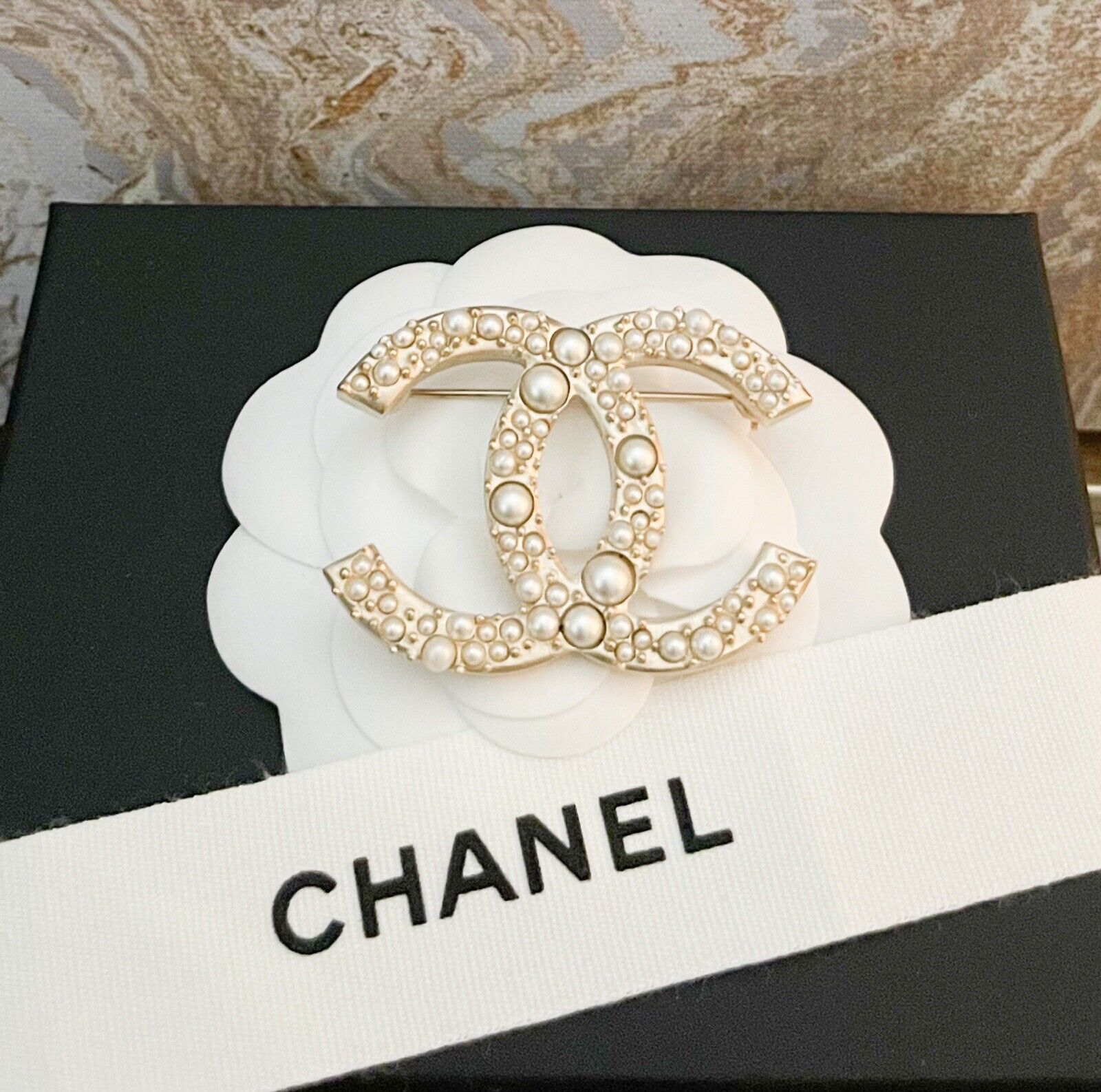 Chanel Vintage Cc Bead Detail Brooch, $775, farfetch.com