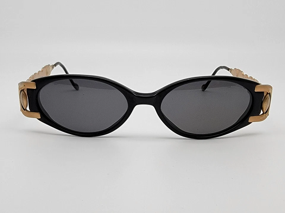 Gafas de sol vintage Revlon Sun 12 marco negro dorado lentes grises 50-16-140 Foto 2 de 4