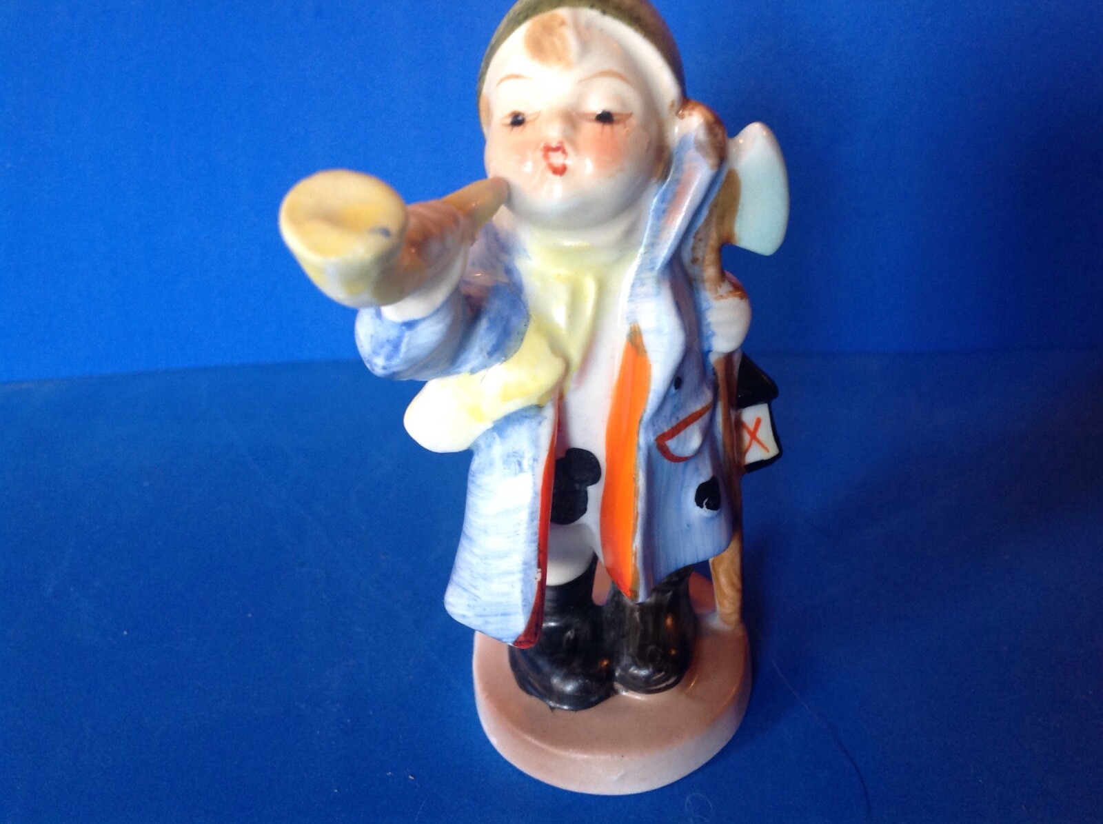 Vintage hand painted little boy figurine holding a horn to his cheek! * Unmarked