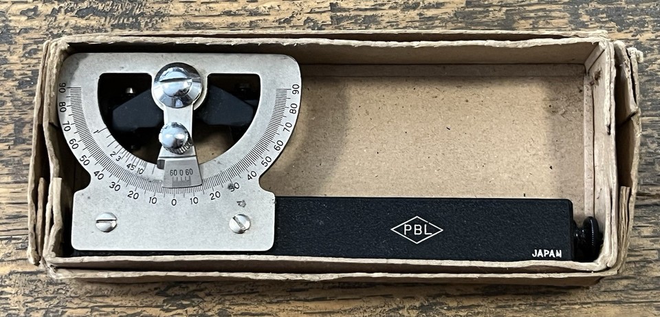 A vintage Abney level clinometer — a brass surveying tool that looks like a prop from a Jules Verne adventure and actually works.