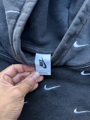grey nike jumper with ticks all over