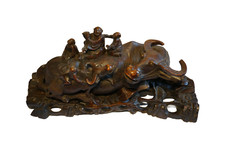 Large hand-carved Asian hardwood statue of a water buffalo with calf, ca. 1900