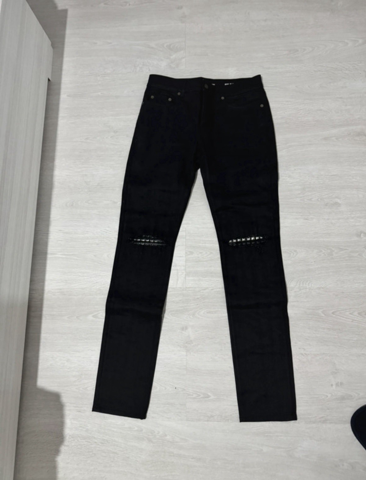 JEANS SAINT LAURENT CON BORCHIE