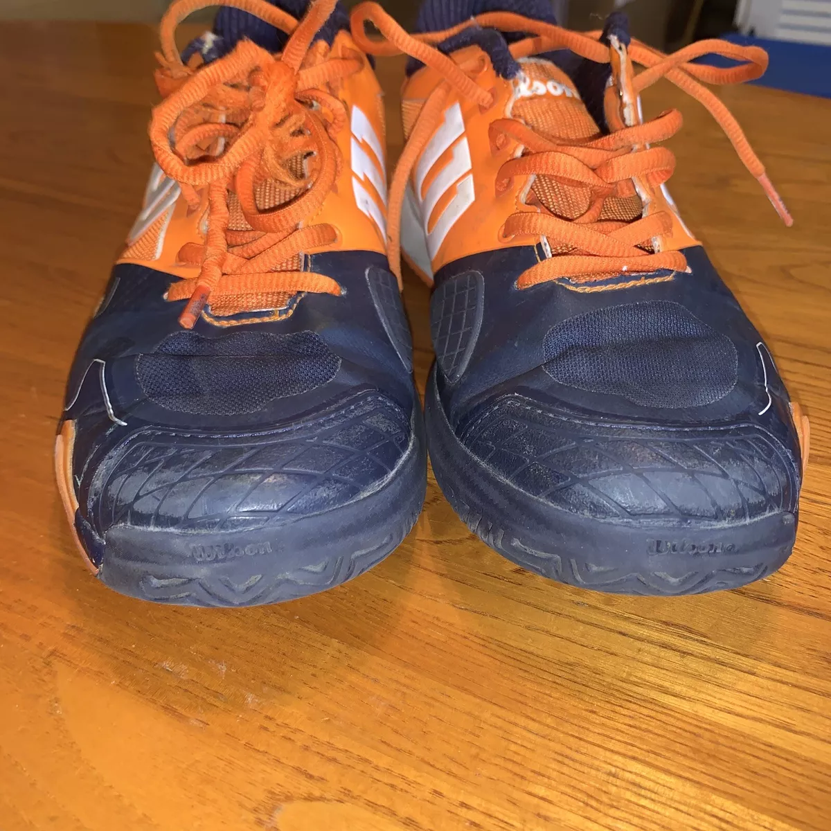 Orange and black tennis best sale shoes