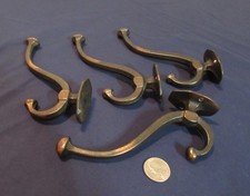4 Beautiful Antique Double Coat Hooks Circa 1900. Iron with Tiger Brass Finish