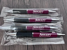 Lot of 4 ARICEPT Medical Drug Rep Pharmaceutical Promo Pen Heavy Metal Ad NEW!