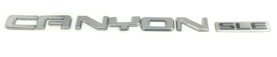 GMC Canyon SLE 2004-2012 portón trasero cromado placa de identificación emblema nuevo OEM 15926160 Foto 2 de 4
