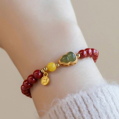 Stilvolles Zinnober Armband verziert mit Gold Intarsien Jade ideal für Damen