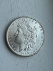 1899 O    MORGAN SILVER DOLLAR  BU light toning