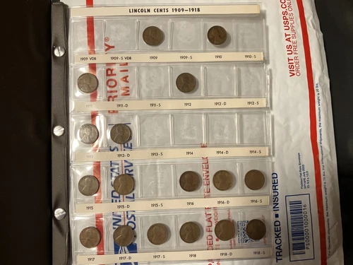 Lincoln coin collection in album including 1909 penny and 1912 penny