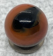 A Vintage Akro Agate Two Color Corkscrew Marble. Measures .62 Mint Condition