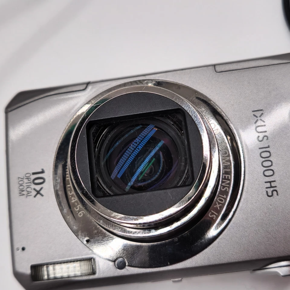 Getestet - Canon IXUS 1000 HS 10,0MP Digital Camera Silver 10x Zoom, Ladegerät - Bild 4 von 4