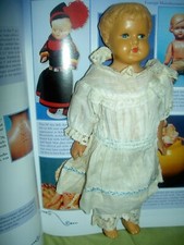 Adorable antique German, originally dressed, jointed celluloid girl doll perfect