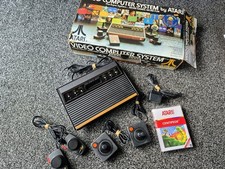 Complete Atari 2600 with box.