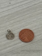 sterling silver Saint Christopher pendant features a textured rope border