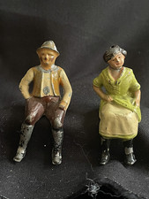 Vintage cast iron miniatures in seated position